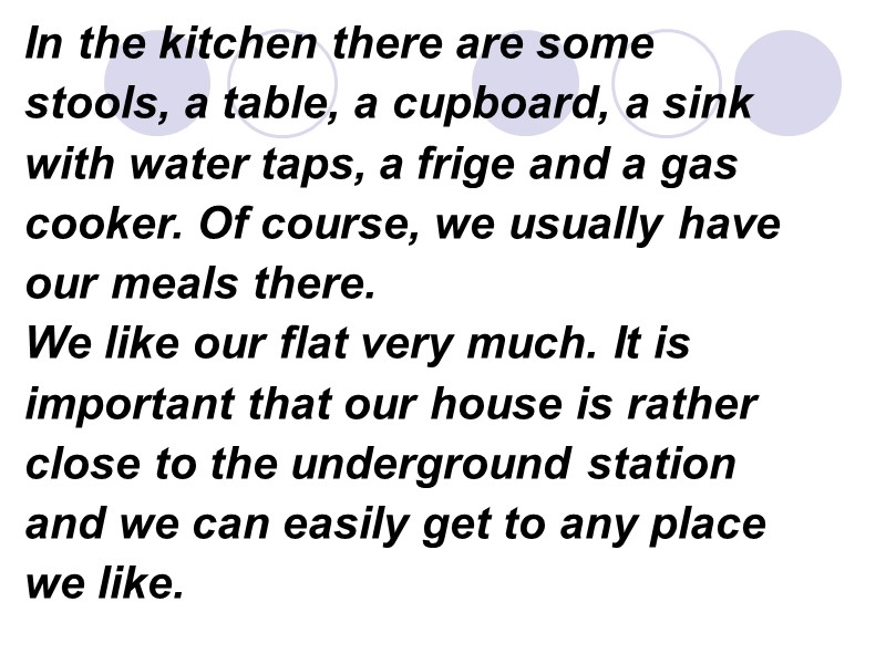 In the kitchen there are some stools, a table, a cupboard, a sink 